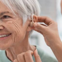 Woman gets fitted with hearing aid