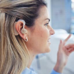 Confident woman with hearing aids